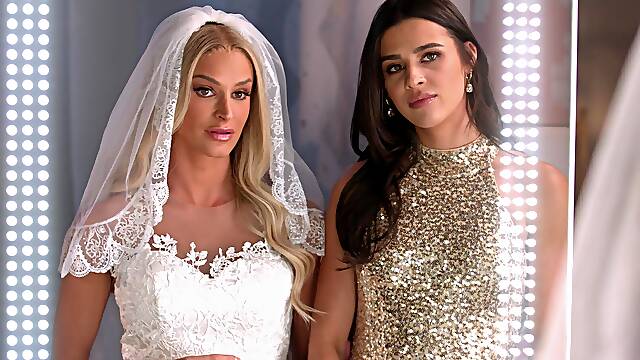 Beautiful bride Emma Hix has hot lesbian sex with stunning Kylie Rocket in a steamy scene.